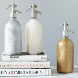 seltzer bottles gold silver white frosted