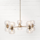Oliver Chandelier - Radial bubble glass seated globe iron gold leaf frame modern front view 